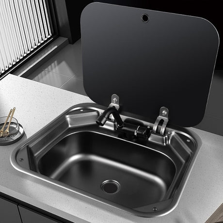 Black 40 × 35 cm stainless steel sink with tap, fitted in a worktop