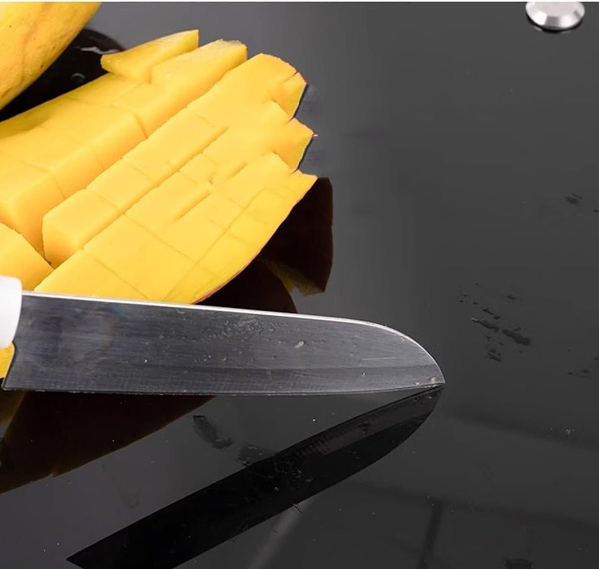 Tempered glass cover of the sink used as a cutting surface