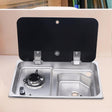 53 × 32 cm stainless steel sink and single gas burner unit, glass cover open